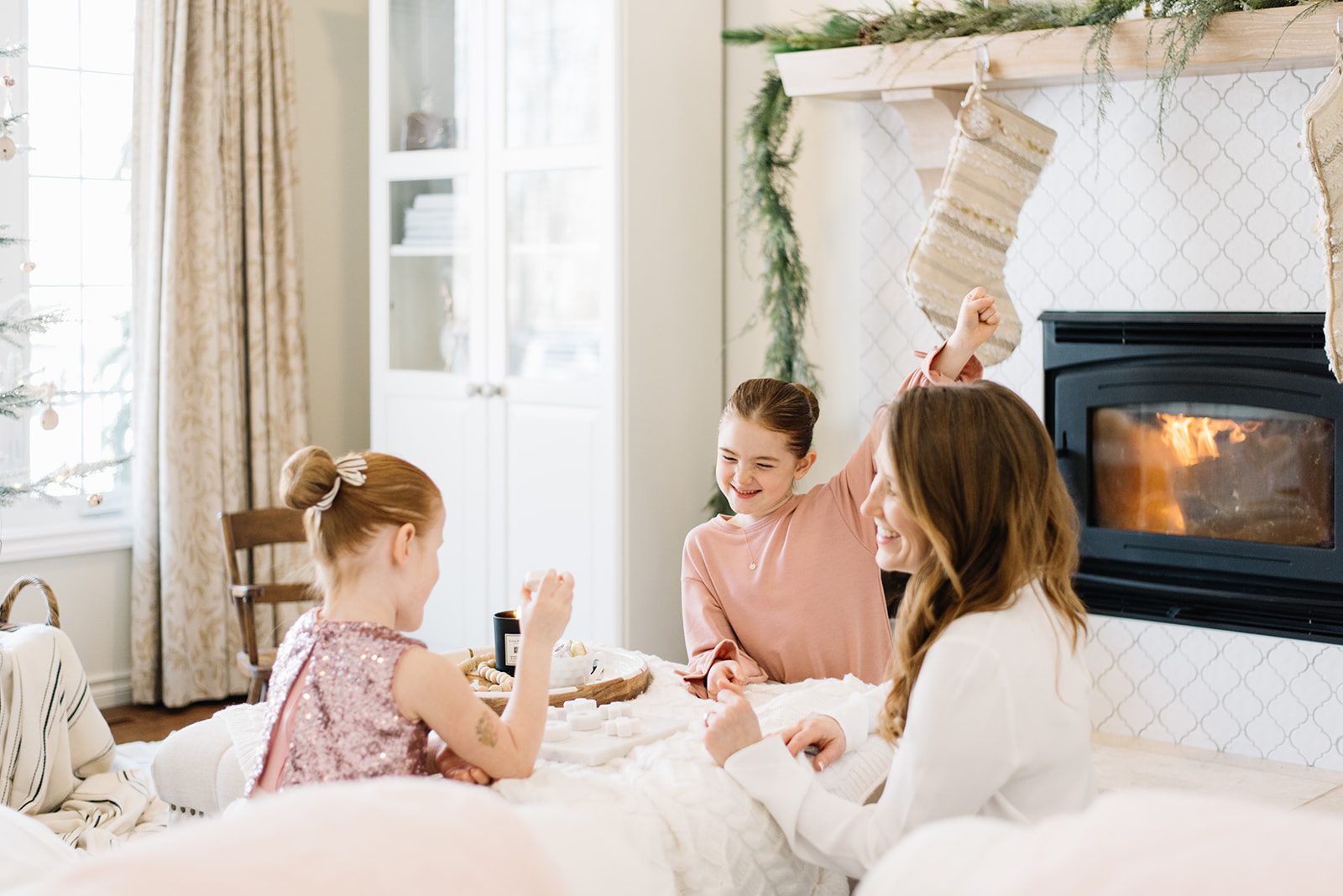 Mom and daughters playing a game
