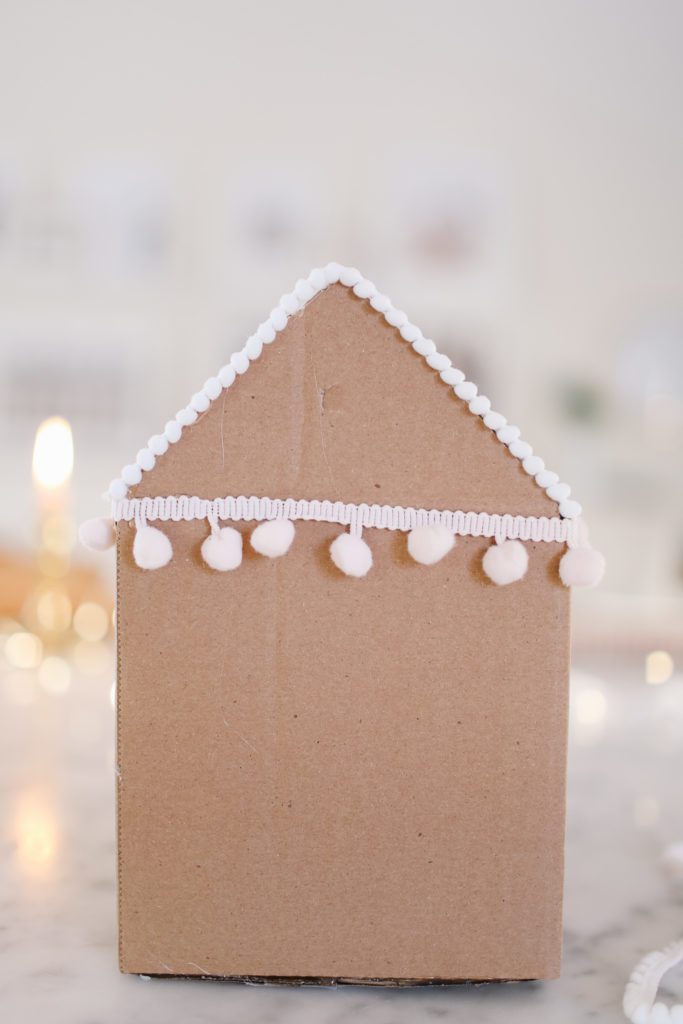 pompom edging on a gingerbread gift box