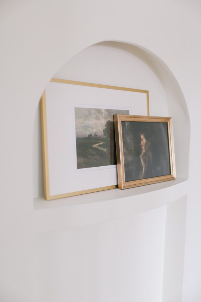 Gold framed prints in an art nook