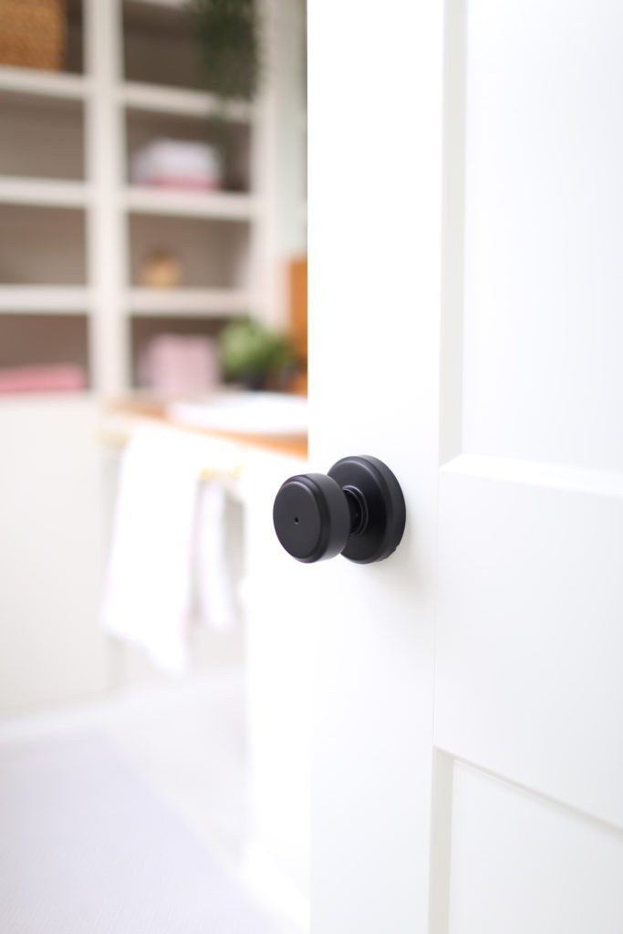 A close up of a black door handle 